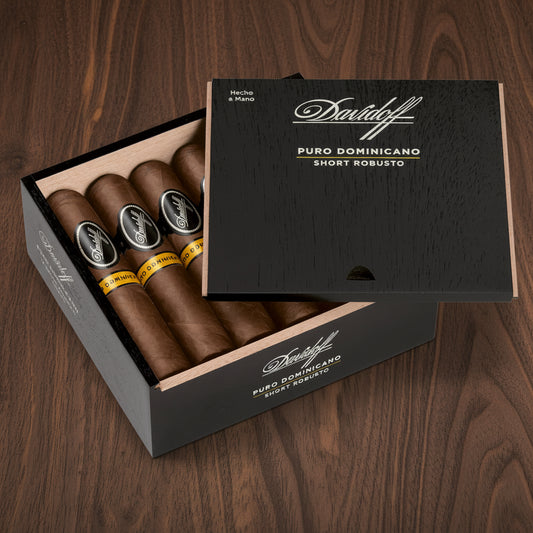 Open box of Davidoff cigars with cigars inside on a white background